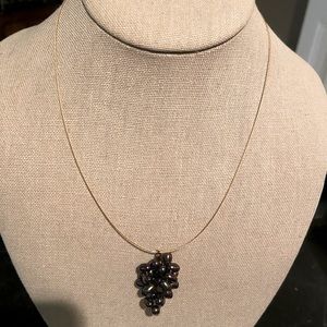 Fresh water Pearl cluster forming a (grape cluster) on a fine cable.